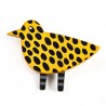 Bird, yellow w black dots, black legs w white stripes