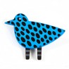 Bird, blue with black spots, black/ white legs