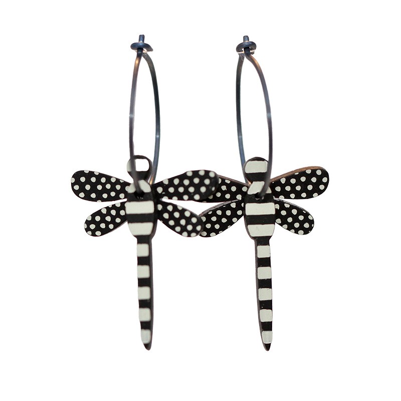 Dragonfly, black with white stripes, black wings