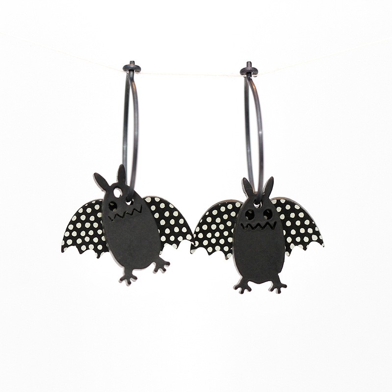 Bat, long, black w black wings w white dots