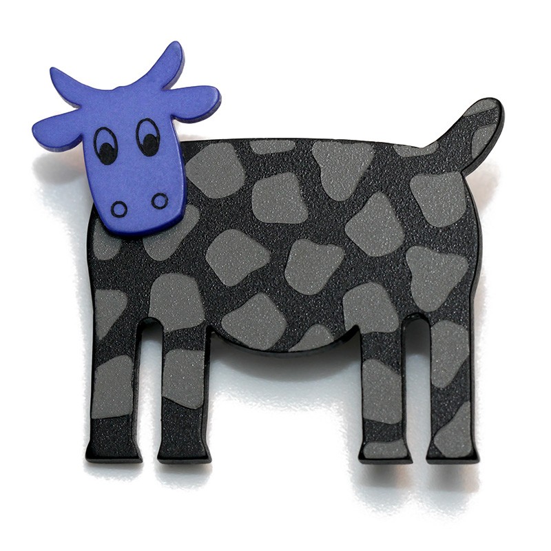 Cow, black w grey spots, blue head