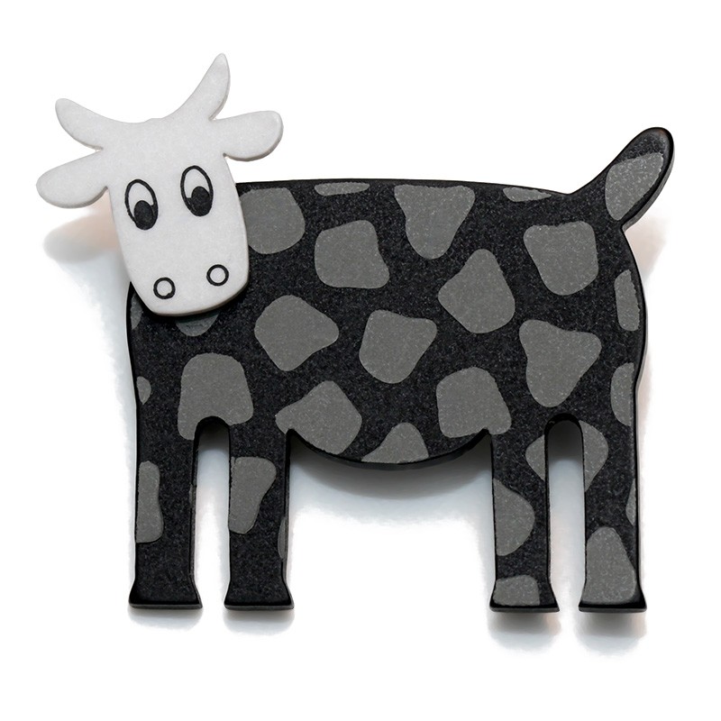 Cow, black w grey spots, white head