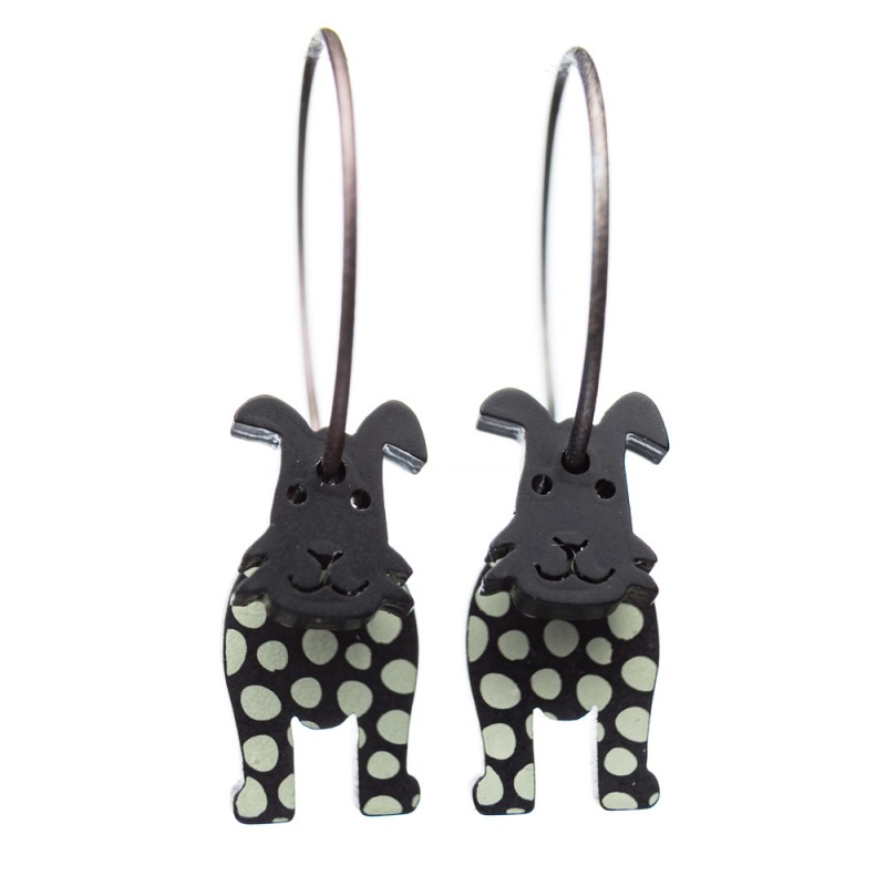 Dog, short ears, black with white dots, black head