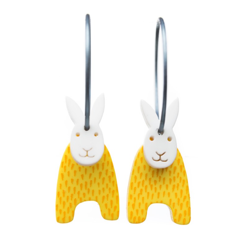 Rabbit, upright ears, yellow w orange dots, white head