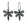 Mosquito, black with white stripes, black wings w white dots